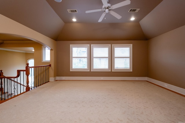 unfurnished room with lofted ceiling, baseboards, visible vents, and carpet flooring