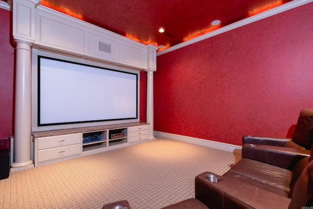 carpeted home theater with crown molding, recessed lighting, decorative columns, and baseboards