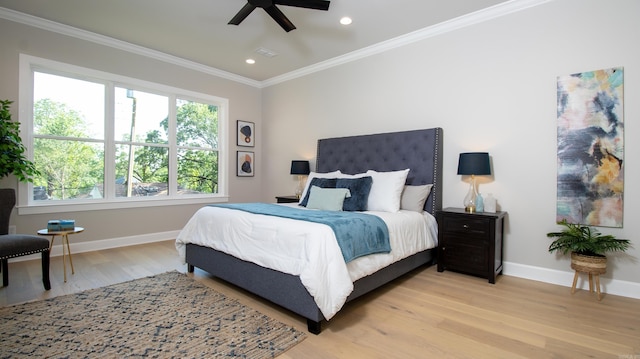 bedroom featuring light wood-style floors, baseboards, ornamental molding, and recessed lighting