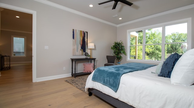 bedroom featuring crown molding, light wood finished floors, recessed lighting, visible vents, and baseboards