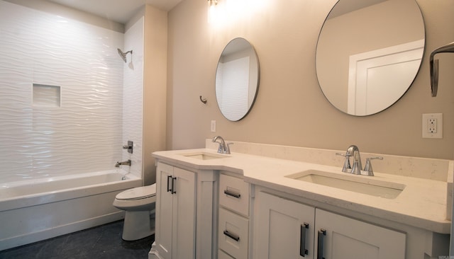 bathroom featuring toilet, double vanity, washtub / shower combination, and a sink