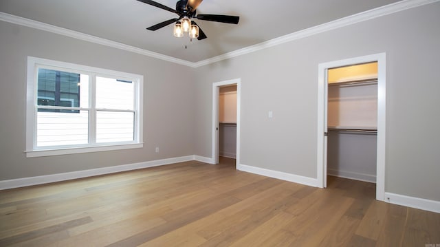 unfurnished bedroom with light wood finished floors, baseboards, and crown molding