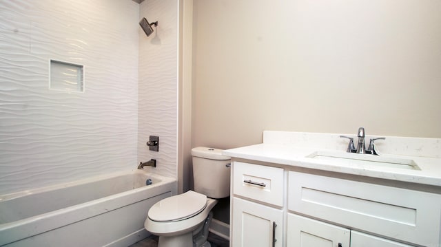 bathroom featuring bathtub / shower combination, vanity, and toilet