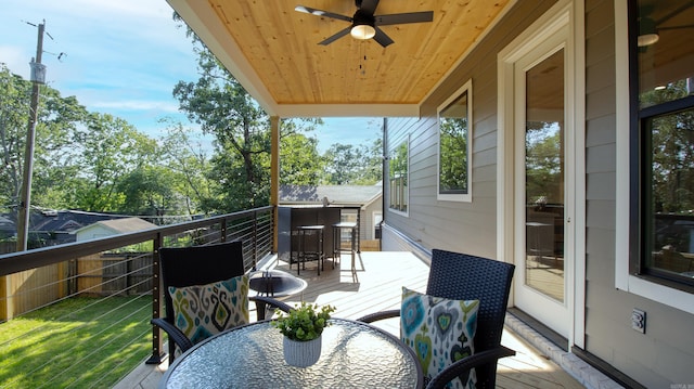 wooden terrace with outdoor dining space