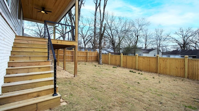 view of yard with stairway and fence