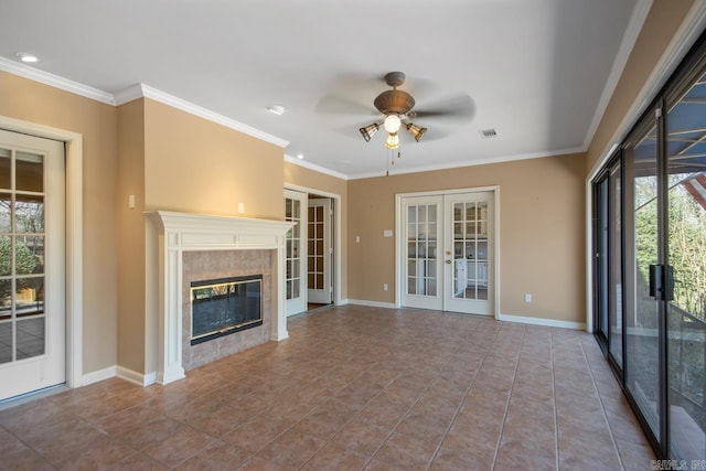 unfurnished living room with ornamental molding, french doors, a high end fireplace, and visible vents