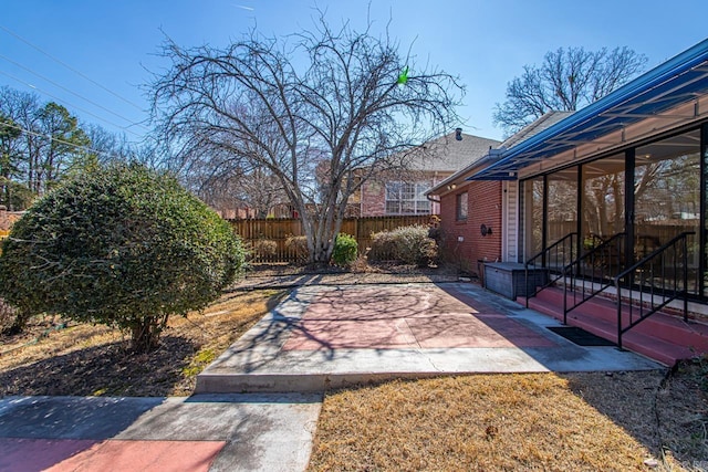 view of yard featuring a patio area and fence