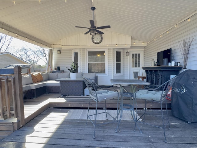 deck featuring ceiling fan, area for grilling, and an outdoor living space