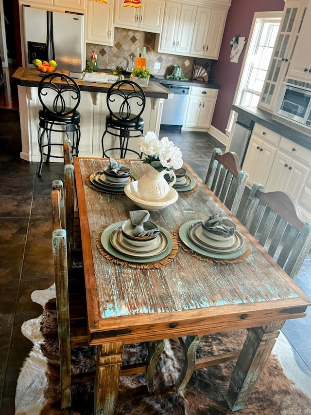 dining space with baseboards