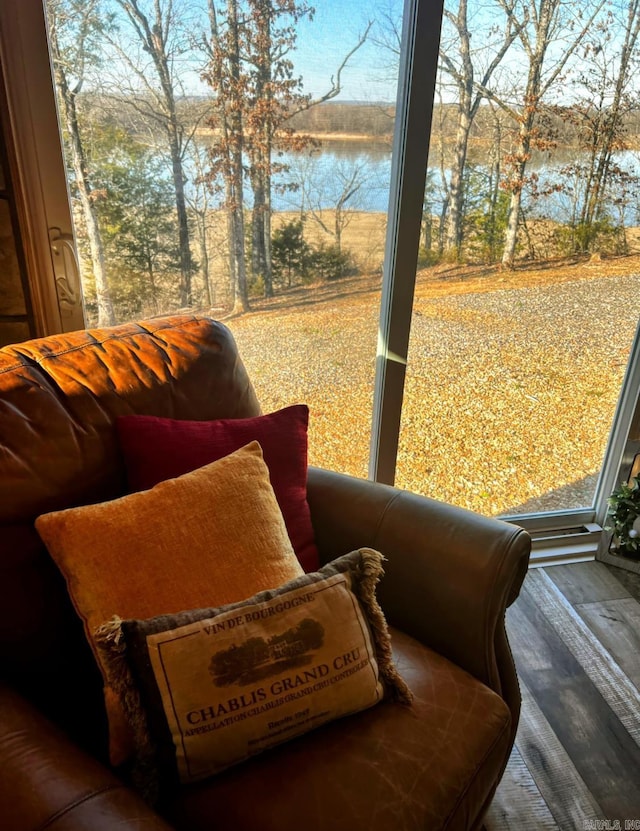 interior space featuring a water view and wood finished floors