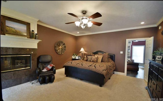 bedroom featuring baseboards, carpet floors, a premium fireplace, and crown molding