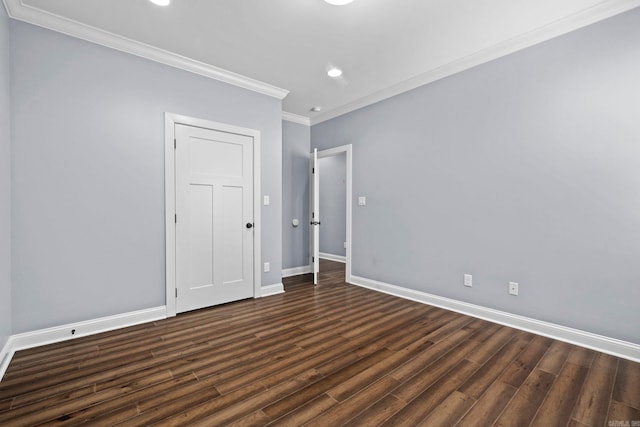 unfurnished room featuring crown molding, baseboards, wood finished floors, and recessed lighting