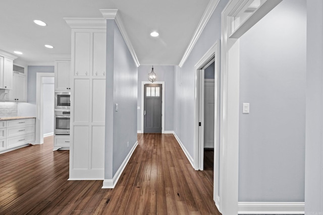 hall with ornamental molding, recessed lighting, baseboards, and dark wood-style floors