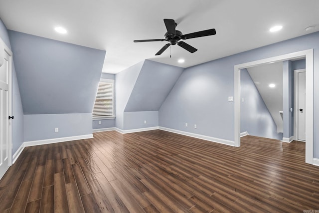 bonus room with vaulted ceiling, recessed lighting, dark wood finished floors, and baseboards