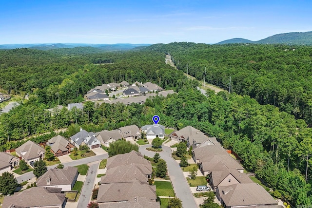 bird's eye view featuring a residential view, a mountain view, and a forest view