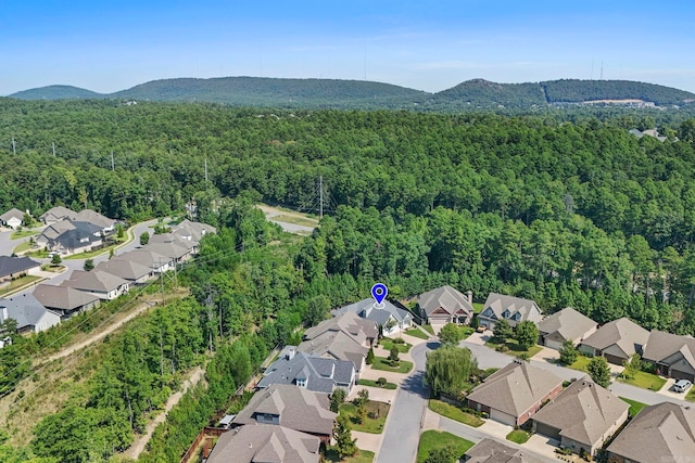 birds eye view of property with a residential view, a mountain view, and a wooded view