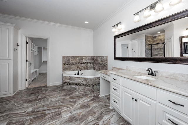 bathroom featuring marble finish floor, ornamental molding, a stall shower, vanity, and a bath