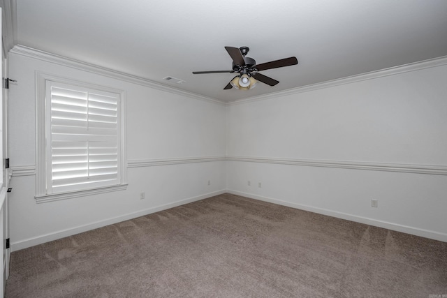 unfurnished room with visible vents, baseboards, a ceiling fan, ornamental molding, and carpet flooring