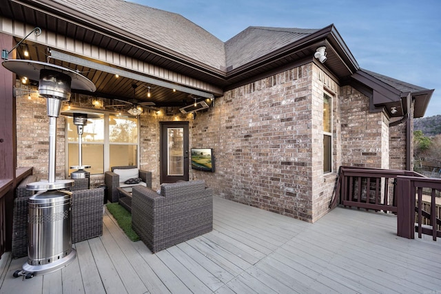 wooden terrace featuring outdoor lounge area