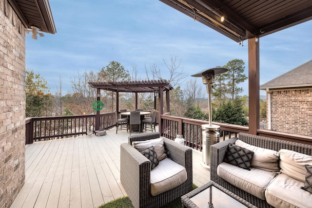 deck with outdoor dining area, an outdoor living space, and a pergola