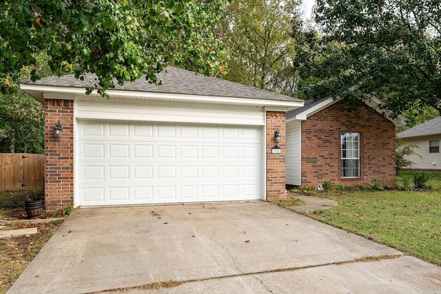 ranch-style home with driveway, roof with shingles, an attached garage, fence, and brick siding