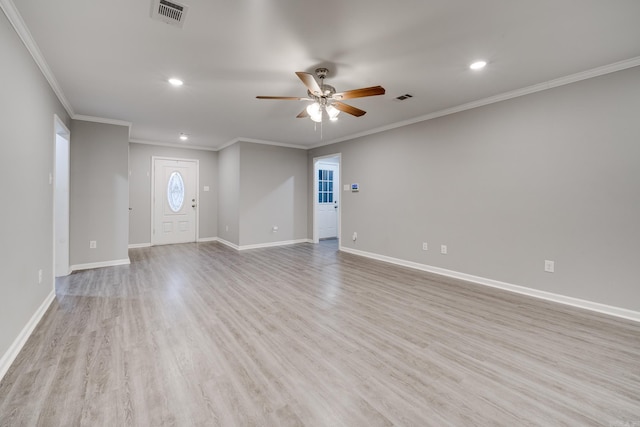 unfurnished living room featuring crown molding, visible vents, light wood-style floors, a ceiling fan, and baseboards