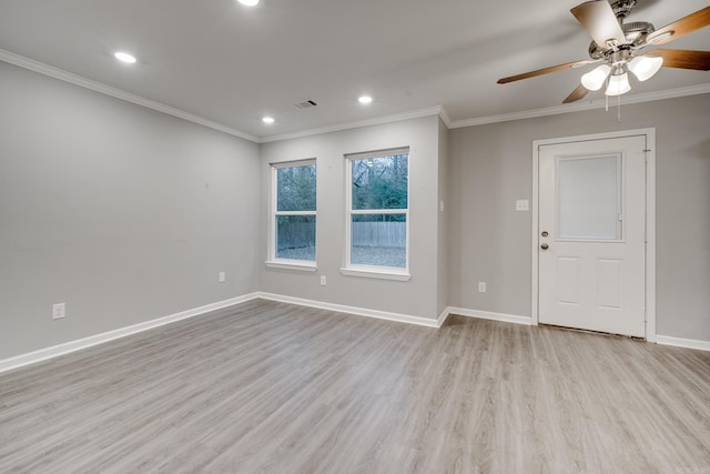 spare room featuring baseboards, visible vents, ornamental molding, wood finished floors, and recessed lighting