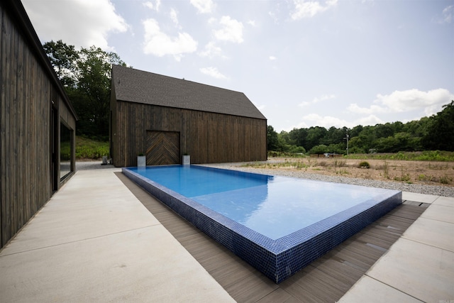 outdoor pool with an outbuilding