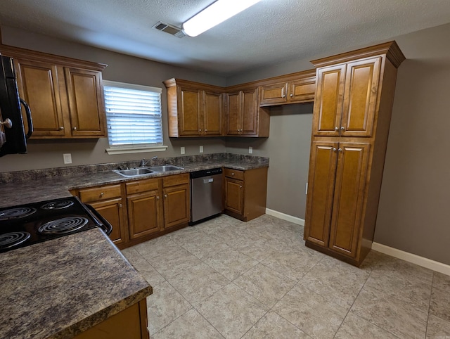 kitchen with a sink, visible vents, dishwasher, brown cabinetry, and dark countertops