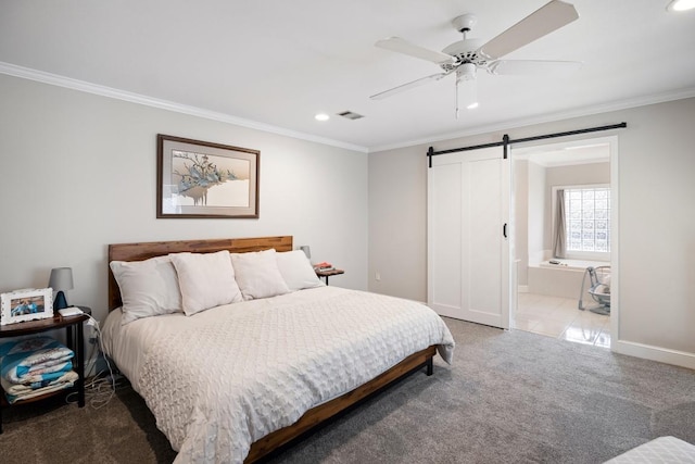 bedroom featuring visible vents, crown molding, carpet flooring, and a barn door