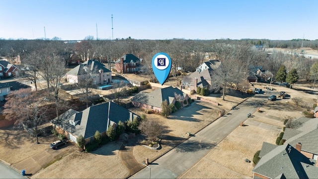 birds eye view of property with a residential view