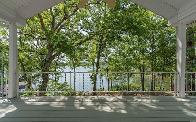 wooden terrace featuring a water view