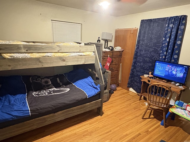 bedroom featuring ceiling fan and wood finished floors