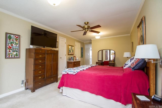 carpeted bedroom featuring ornamental molding, connected bathroom, baseboards, and ceiling fan