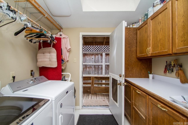 washroom with independent washer and dryer and cabinet space