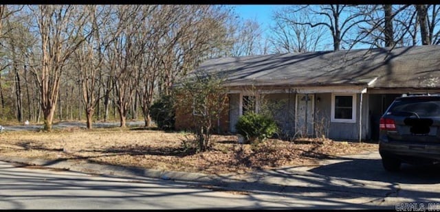 view of front of home with a carport