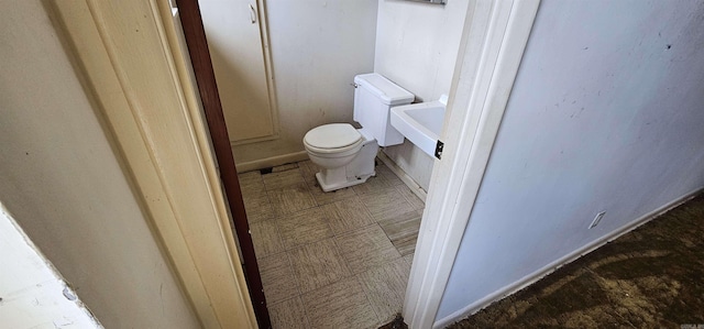 bathroom featuring toilet