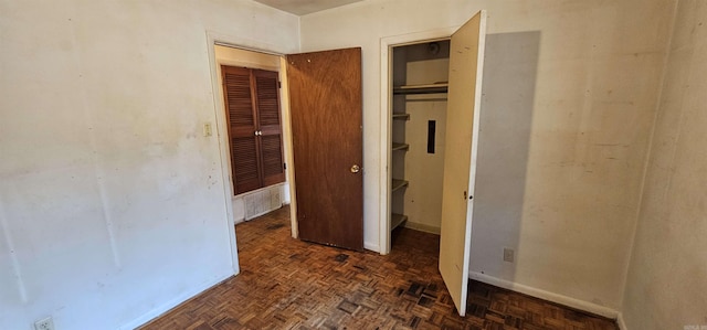 unfurnished bedroom with baseboards