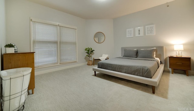 bedroom with carpet flooring and baseboards