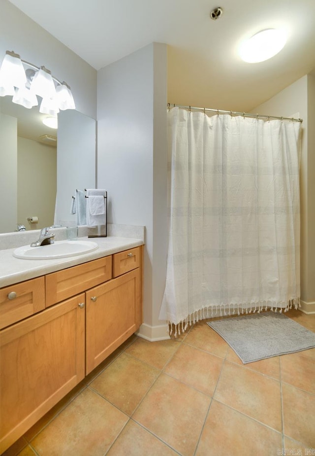 full bath with tile patterned flooring, vanity, and a shower with curtain