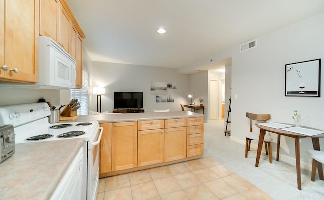 kitchen featuring light countertops, visible vents, open floor plan, white appliances, and a peninsula