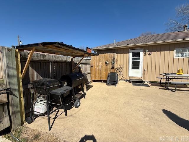 view of patio featuring fence