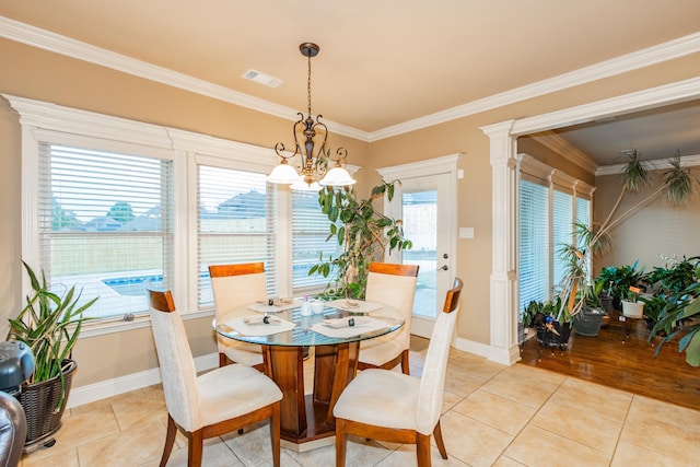 dining area with ornamental molding, visible vents, baseboards, and light tile patterned floors