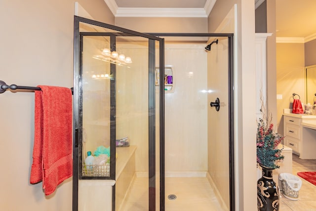 full bathroom with a stall shower, vanity, and crown molding