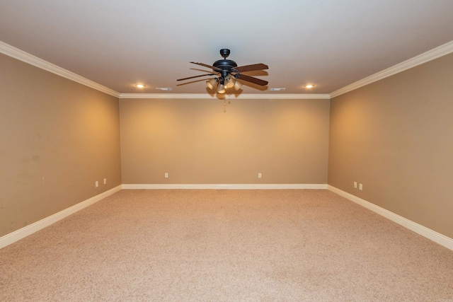 spare room featuring recessed lighting, crown molding, and baseboards