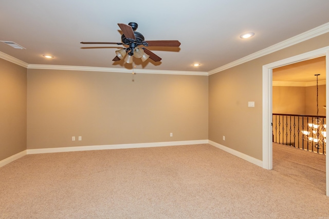 unfurnished room featuring visible vents, ornamental molding, baseboards, and light colored carpet