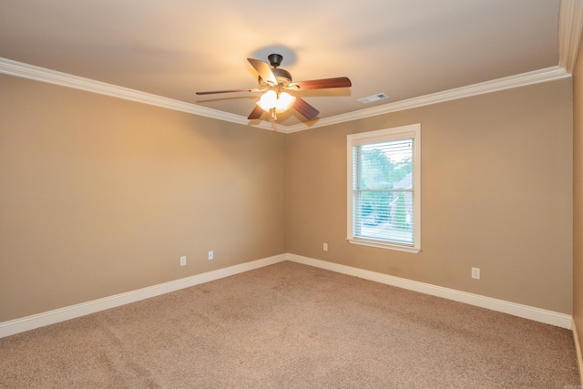 unfurnished room featuring light colored carpet, visible vents, crown molding, and ceiling fan