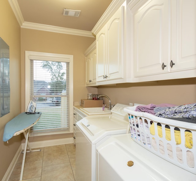 laundry area with visible vents, a sink, cabinet space, and crown molding