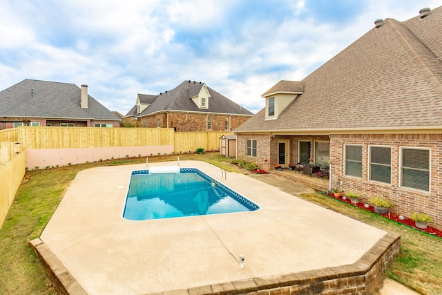 view of pool with a patio area, a fenced backyard, and a fenced in pool