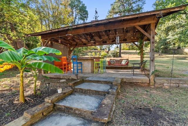 view of property's community featuring outdoor dry bar and a patio area